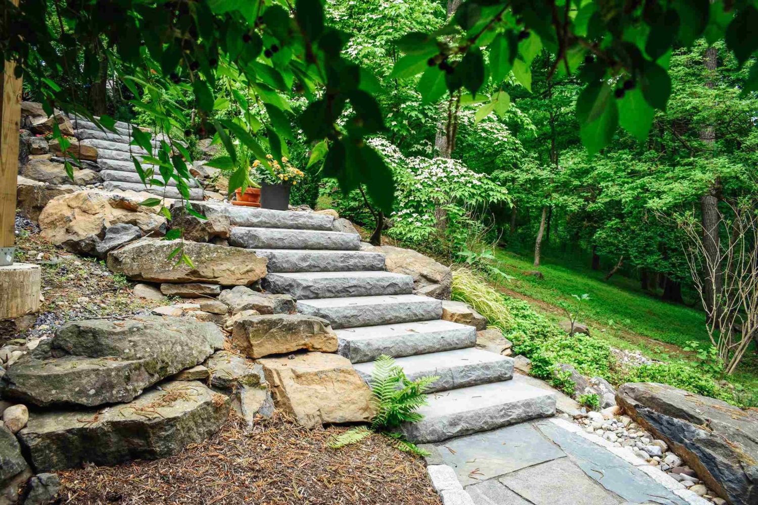 Boulder steps with deck and water feature