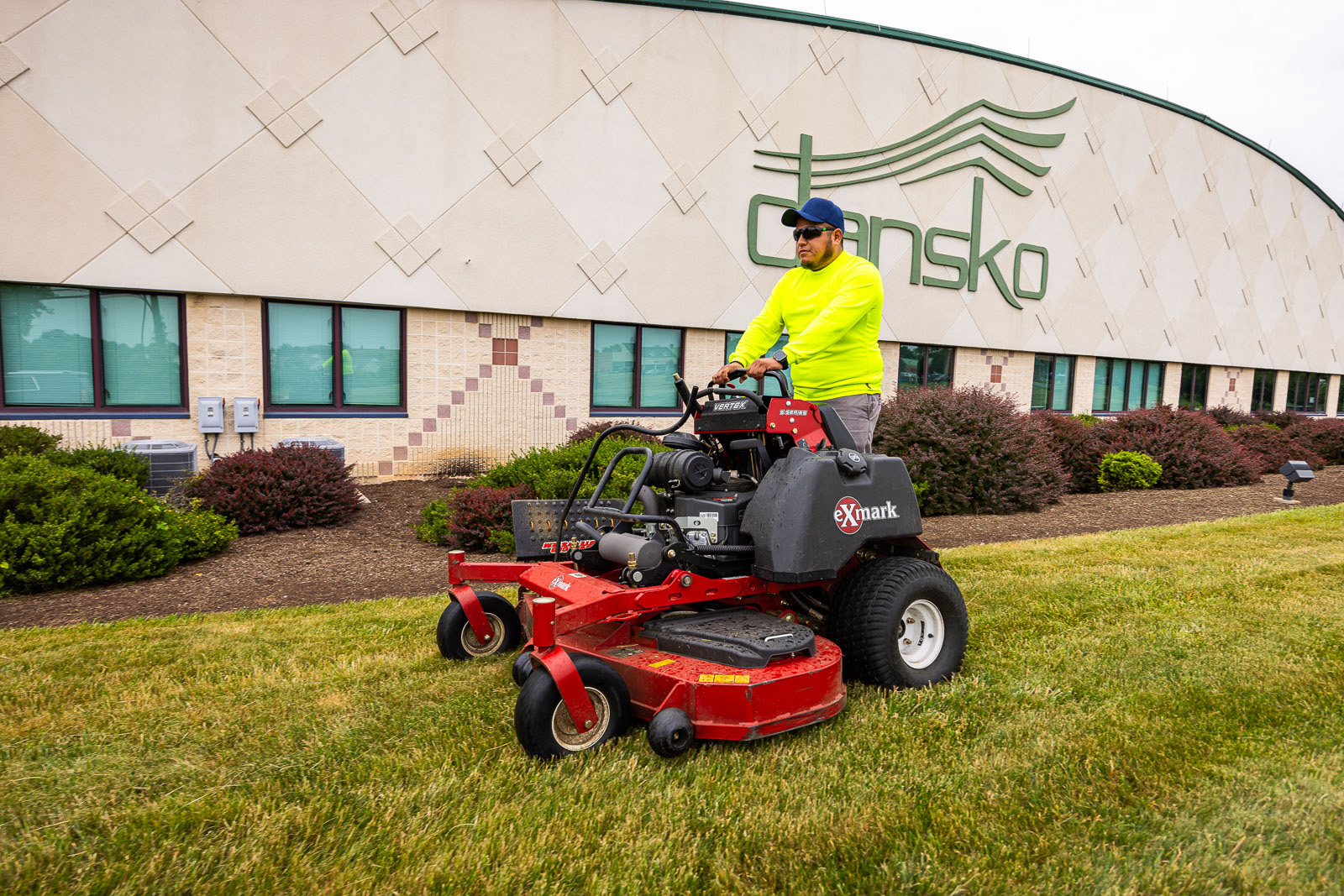 Pickel Landscape Group crew member mowing an HOA commercial property in Chester County