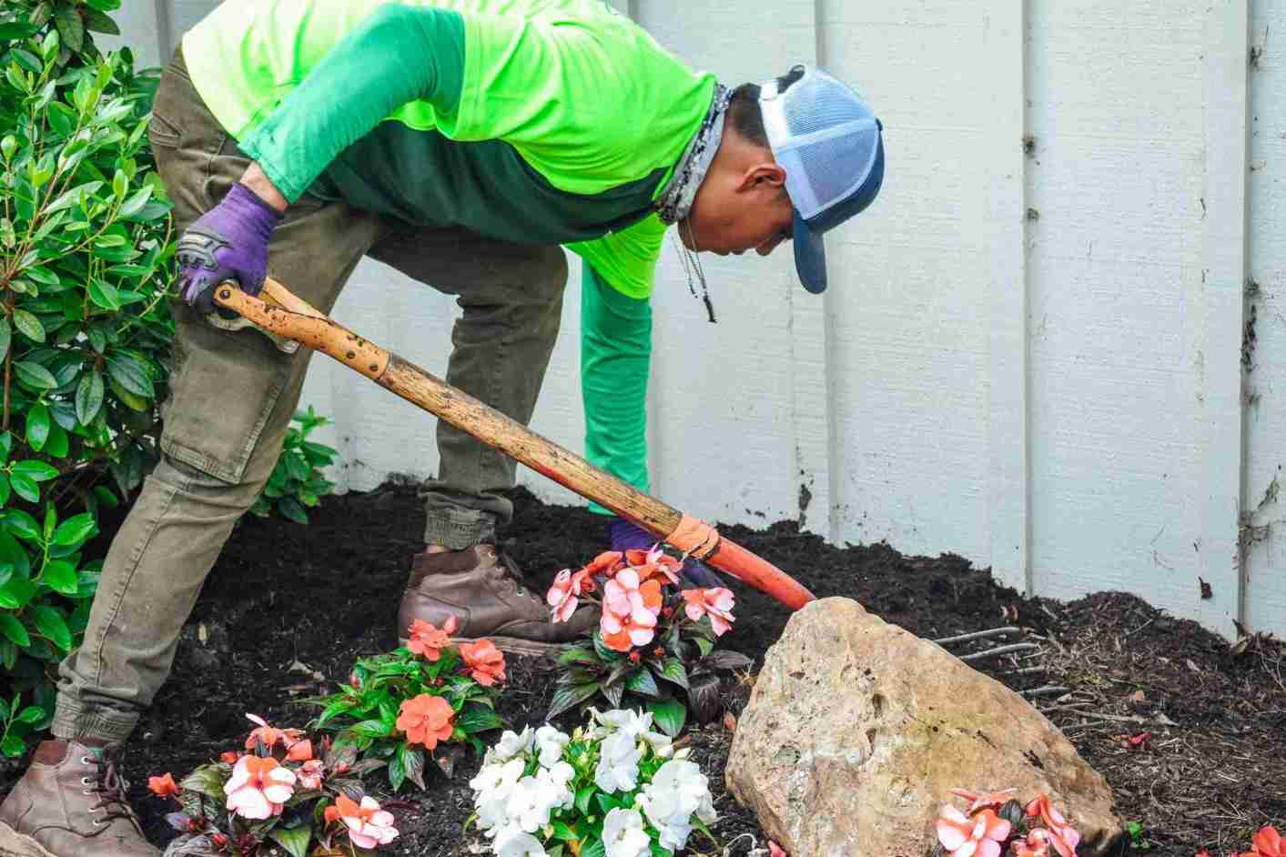 Crew mulching flower bed — winter mulching in Chester County