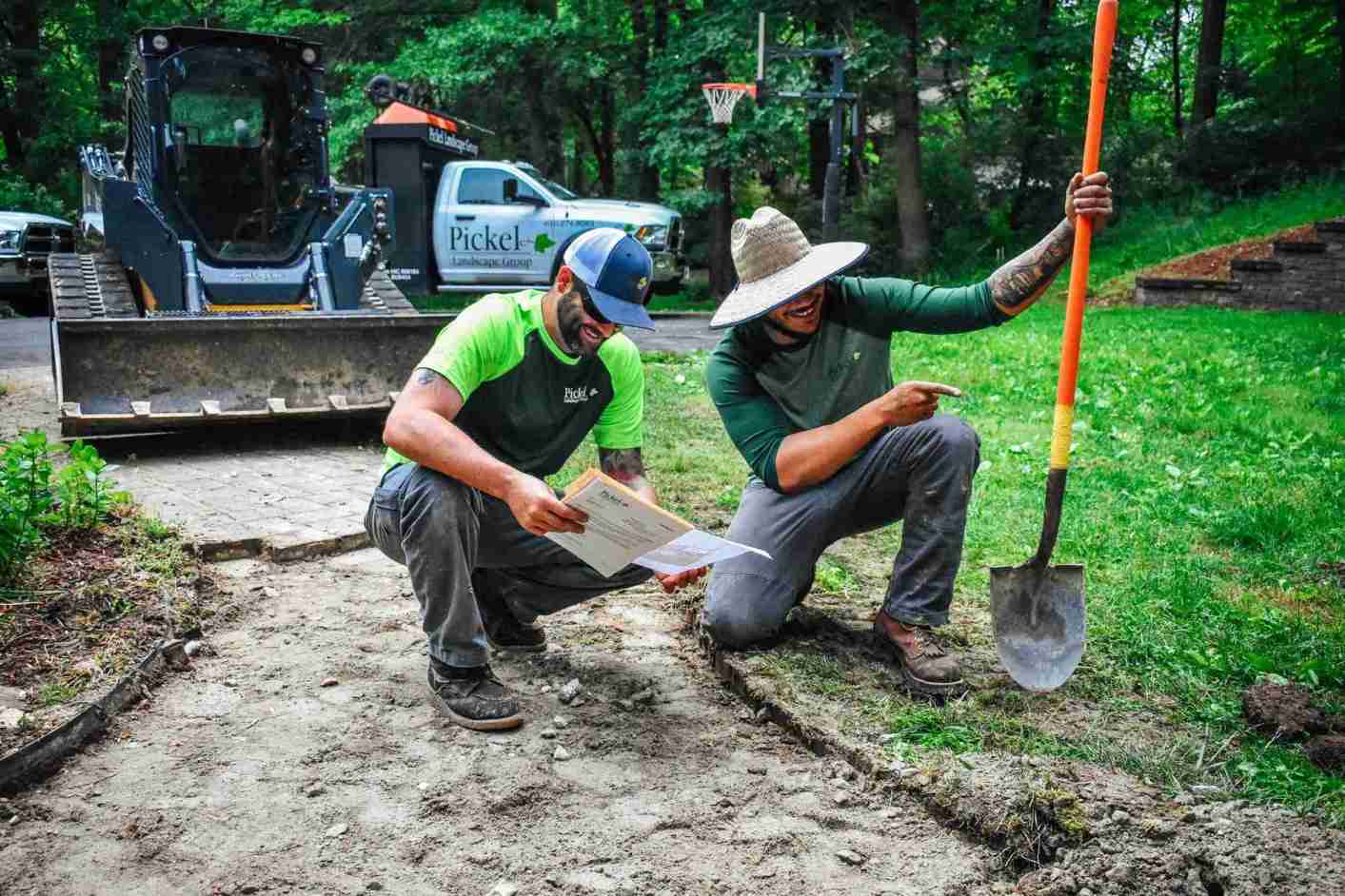 Crew reviewing landscape plans
