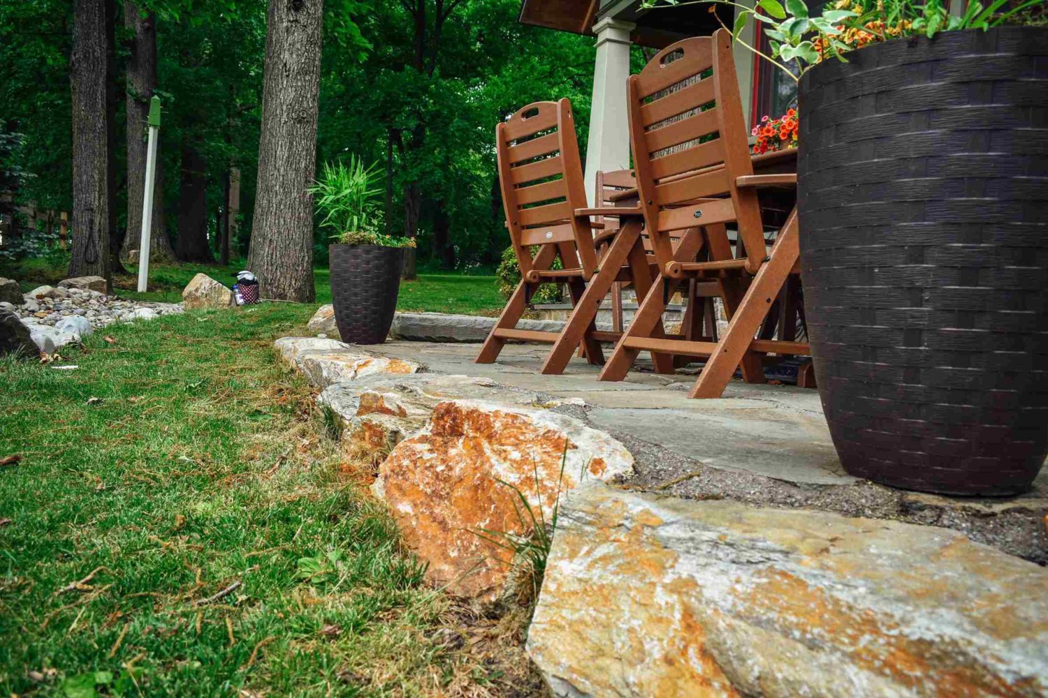 Stone wall patio detail with bluestone cap