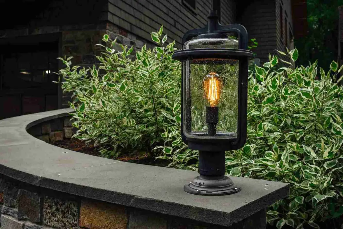 Low-voltage pathway lights illuminating a garden walkway at dusk
