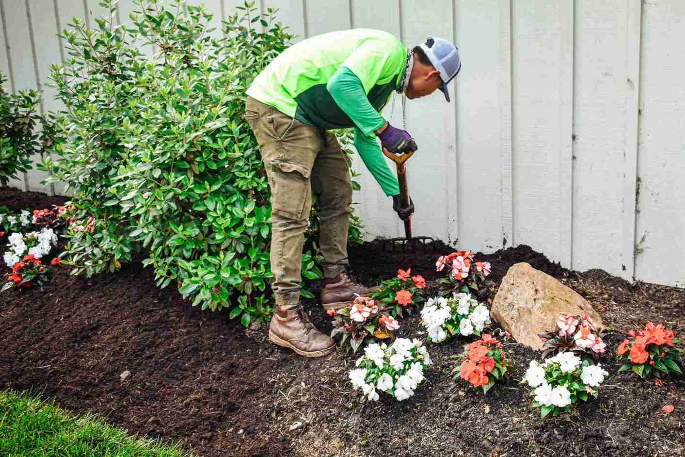 Pickel Landscape Group professional planting colorful flowers and maintaining garden beds in Chester County
